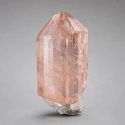Raw Morganite crystal specimen showing natural mineral texture and coloring